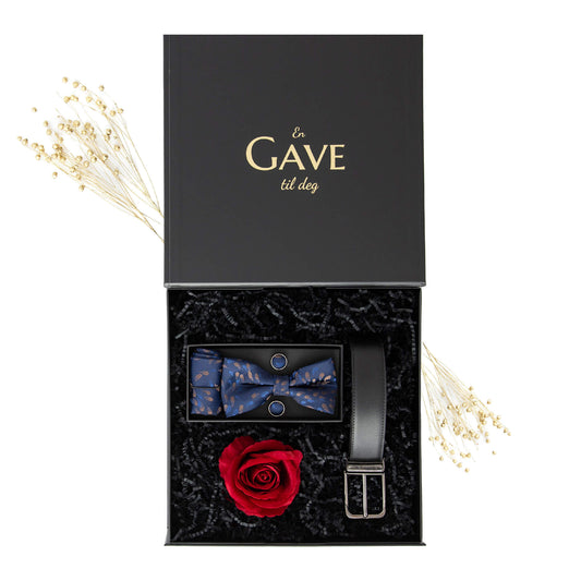 Gave til kjæresten med sløyfesett, belte og en rød rose i en sort gaveeske.