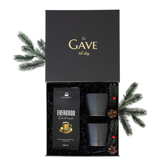 Julegave til han eller henne med kaffe og svarte kopper. Alt i en elegant åpen svart gaveeske.