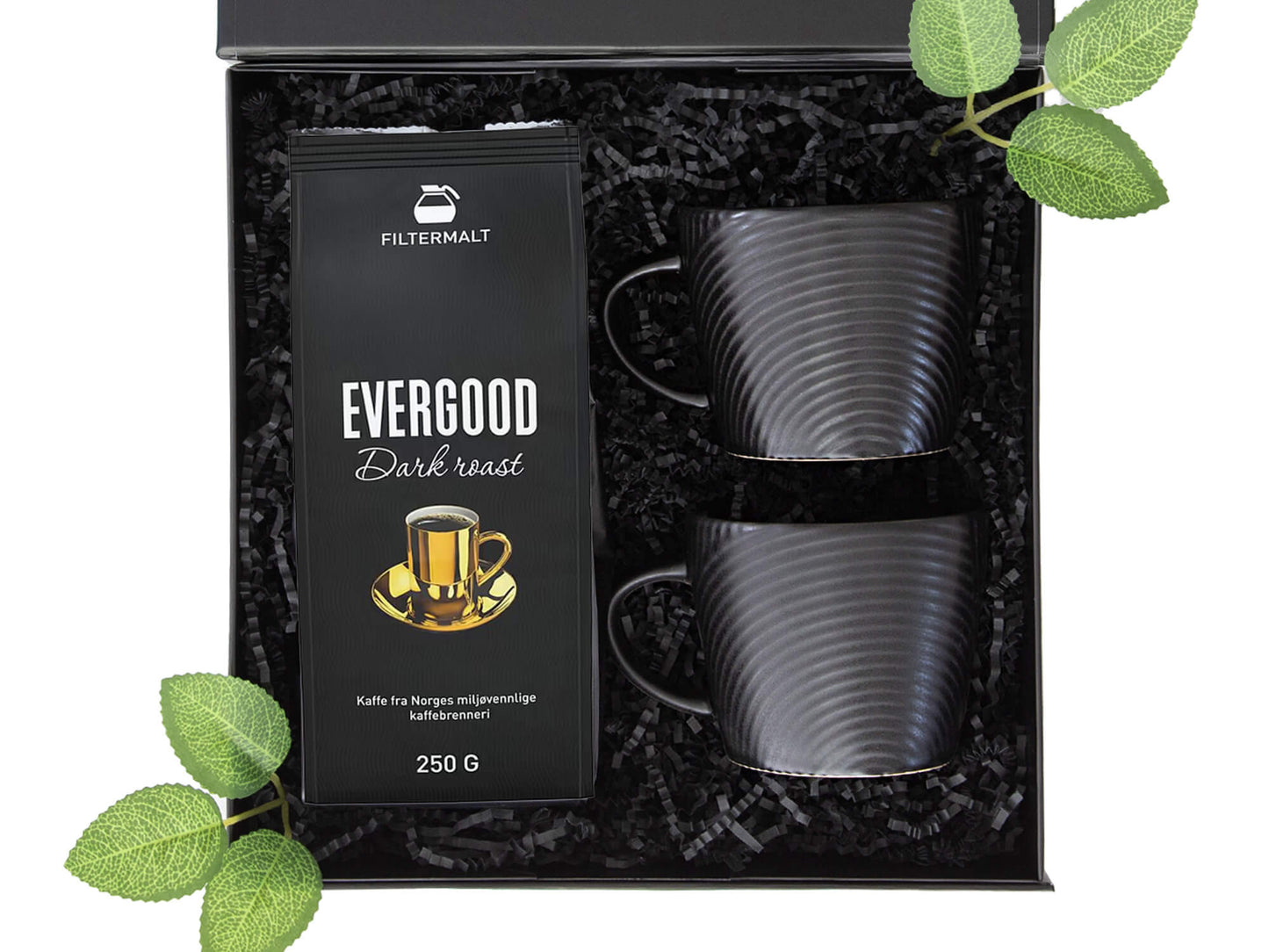 Svart gaveeske med kaffe, kopper.