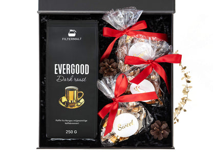 Julegave med kaffe og deilige sjokolader i en svart gaveeske.