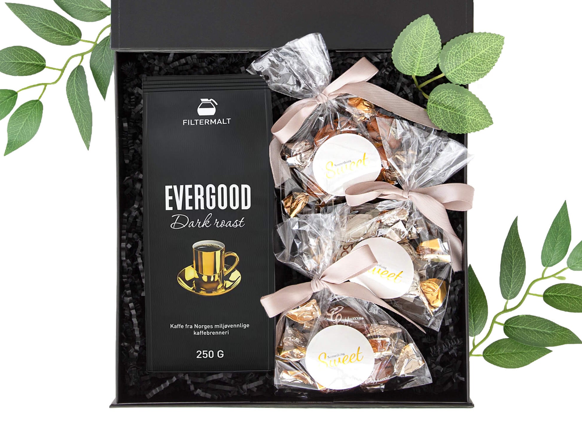 Gave med kaffe og deilige sjokolader i en svart gaveeske.