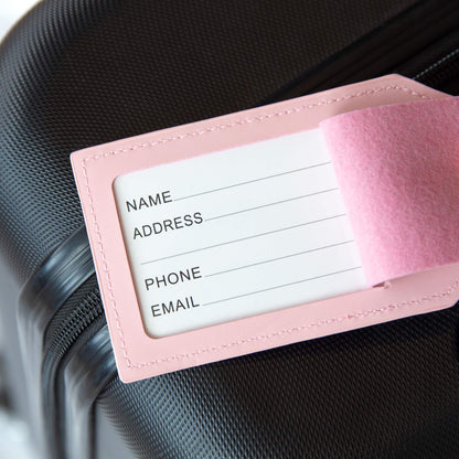 Innside av rosa bagasjelapp