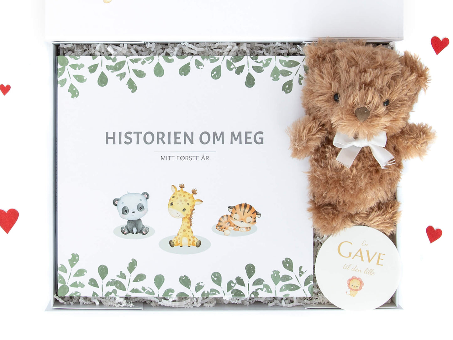 Gaveeske med babyjournalen "En historie om meg" som tar for seg den nyfødtes første år og en super koselig kosebamse.