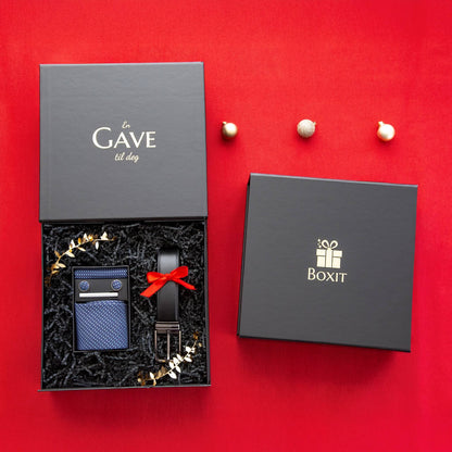 En åpen svart gaveeske med kvalitetsprodukter og en lukket svart gaveeske. Eksklusive gaver til jul.