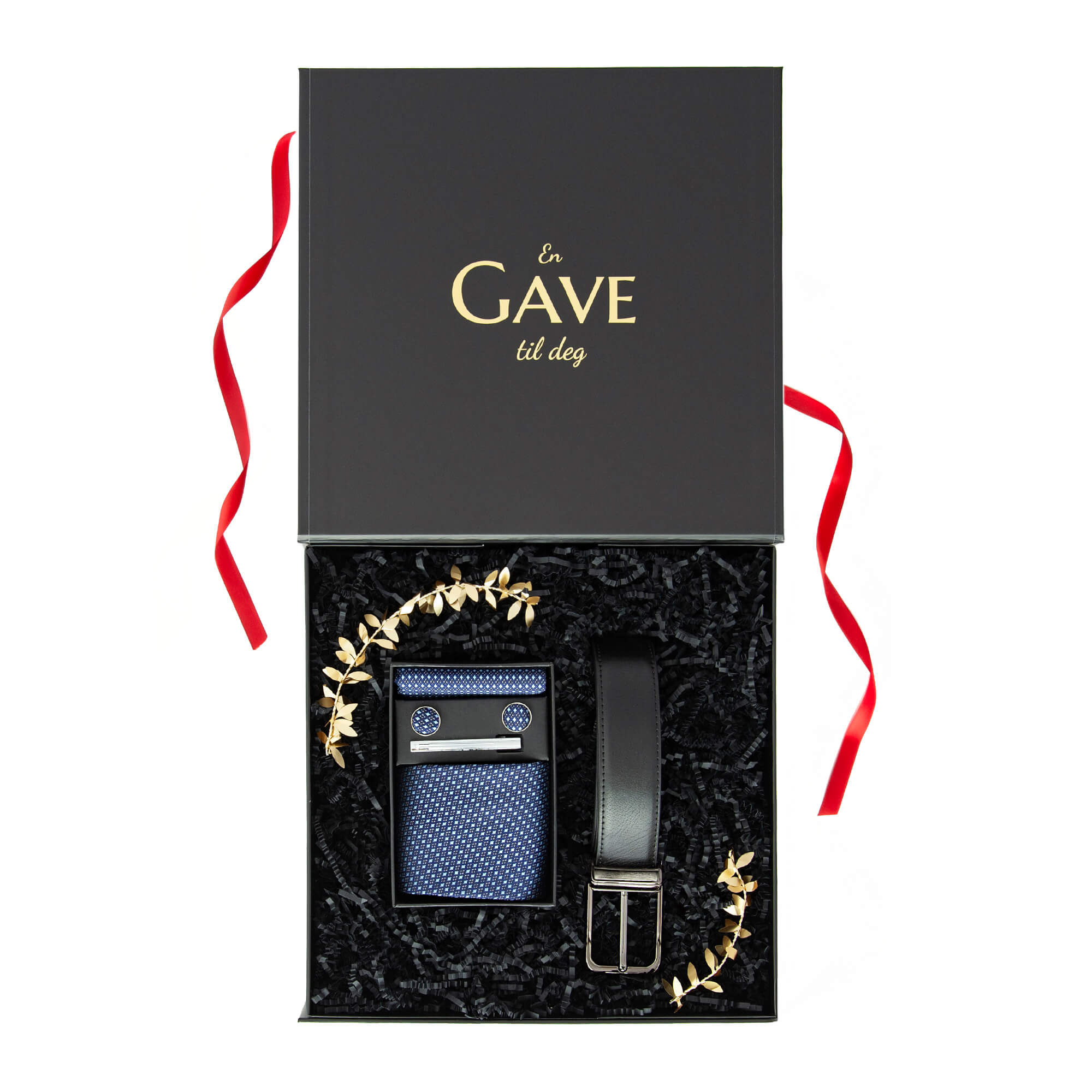 Julegave til han med belte og slipssett pakket i en stilren svart gaveeske.