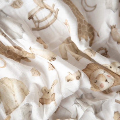 Detaljer fra babypledd med dyremotiver.